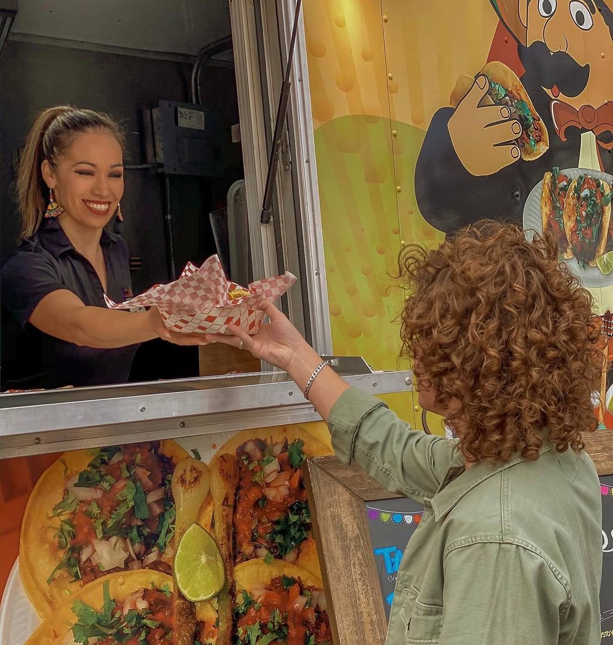 Jalisco Food Truck staff serving guests at a catering event